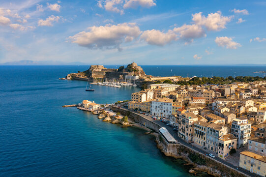 Fototapeta Panoramic view of Kerkyra, capital of Corfu island, Greece. Aerial drone view of Kerkyra with beautiful buildings during summer sunny day. Corfu island, Greece.