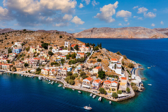 Aerial view of the beautiful greek island of Symi (Simi) with colourful houses and small boats. Greece, Symi island, view of the town of Symi (near Rhodes), Dodecanese.