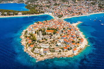 Aerial view of Primosten old town on the islet, Dalmatia, Croatia. Primosten, Sibenik Knin County, Croatia. Resort town on the Adriatic coast. Aerial view of adriatic town Primosten, Croatia - 627755058