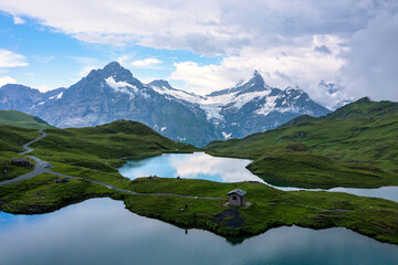 Bachalpsee lake at dawn, Bernese Oberland, Switzerland. Alpine view of the Mt. Schreckhorn and...