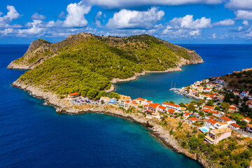 Fototapeta na wymiar Aerial drone view video of beautiful and picturesque colorful traditional fishing village of Assos in island of Cefalonia, Ionian, Greece. Peninsula of Assos in Cephalonia (Kefalonia), Greece