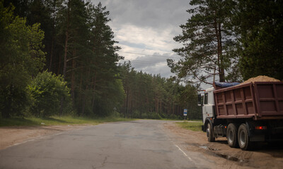 Cars, truck and highway road in the countryside	