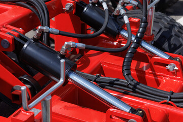 Hydraulic mechanisms of agricultural machinery and equipment.  - obrazy, fototapety, plakaty