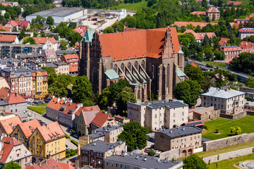 Saints Peter and Paul Church in Strzegom, historic brick Gothic minor basilica aerial landscape