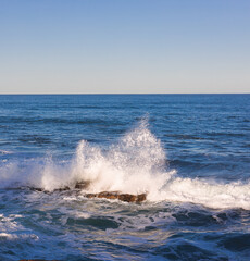 Wave breaking over rock La Jolla San Diego California