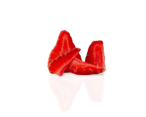 Red ripe strawberries cut into pieces on a white background isolate