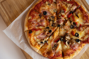 pizza with bacon olives and mushrooms