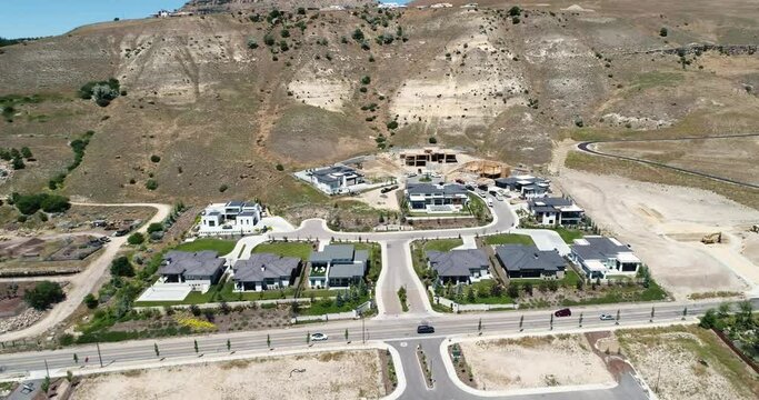 Aerial 4k view of a new custom home construction site next to foothills in Boise, Idaho