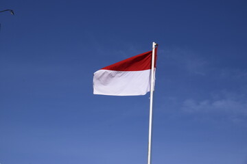 indonesian flag with blue sky