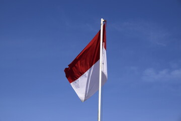 indonesian flag with blue sky