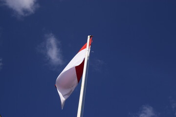 indonesian flag with blue sky