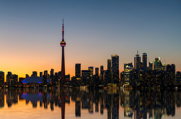 Toronto City skyline at sunset with reflection in the lake, Toronto, Ontario, Canada. Long exposure. - 627765800