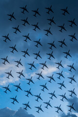 Background of cloudy sky and many airplanes flying 