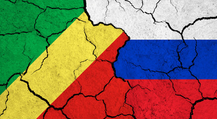 Flags of Congo and Russia on cracked surface - politics, relationship concept