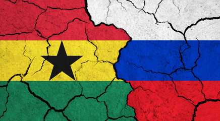 Flags of Ghana and Russia on cracked surface - politics, relationship concept