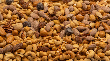 A group of almonds, pistachios, walnuts, macadamia, cashews.