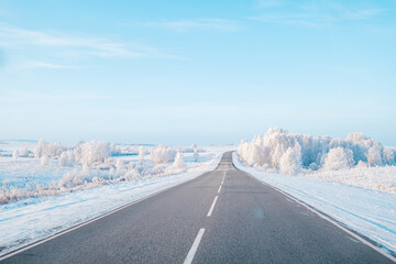 Winter landscape, car road, fresh frosty sunny day