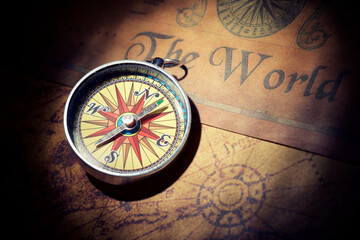Fototapeta na wymiar Vintage compass on an old paper map