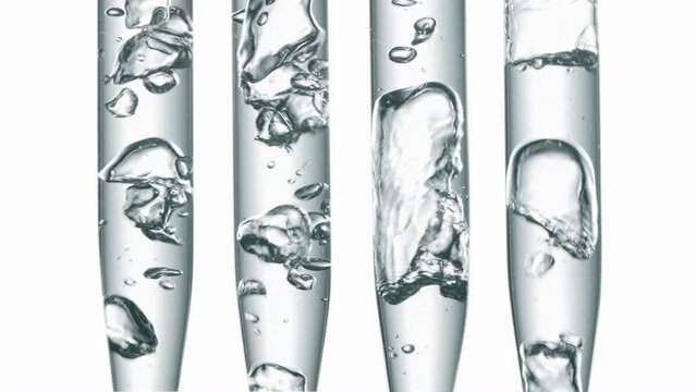 Glass test tubes with liquid on white background.