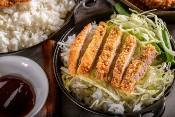 Savory Delights: Close-Up of Deep-Fried Orange Chicken Served on a Bed of Steamed White Rice, Captured in 4K Resolution