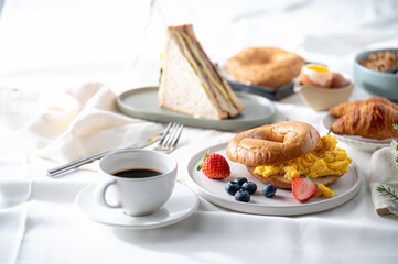 Breakfast eggs berries and strawberry fruit on a white plate