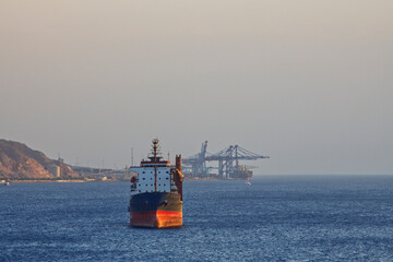 Big transportation ship anchored at the red sea