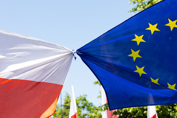 Polish and European Union flags on a protest march. A manifestation of sympathy for the European...