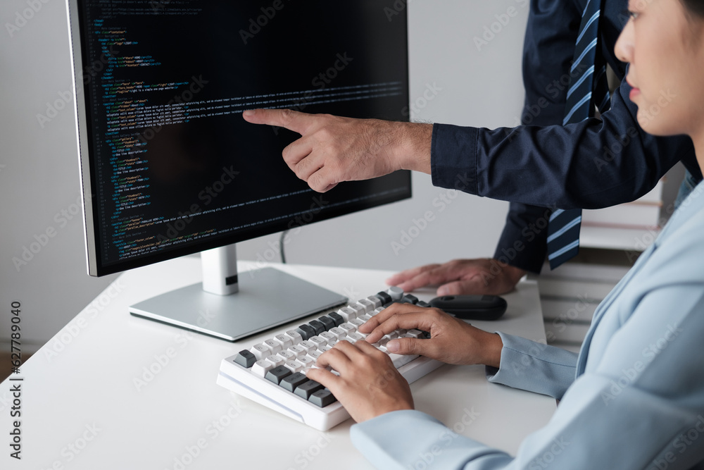 Poster Team of programmer pointing to desktop computer with developing programming code, trying to solve the problem.