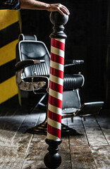 Barber shop chair. Barbershop armchair, salon, barber shop for men. Barber shop pole. Logo of the...