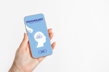 Psychotherapy, mental health concept. Female hands hold a phone with a mobile application on psychology