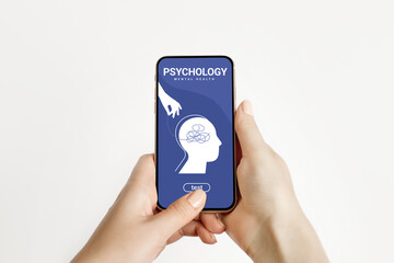Psychotherapy, mental health concept. Female hands hold a phone with a mobile application on...