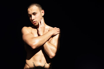 Naklejka premium Young attractive guy is resting and posing at home.