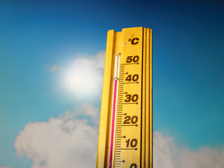 Hot summer day, the thermometer displays a high heatwave temperature of 43 degrees Celsius. A red...