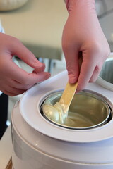 Advertising hot wax for depilation, beauty industry. 