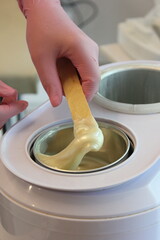 Advertising hot wax for depilation, beauty industry.