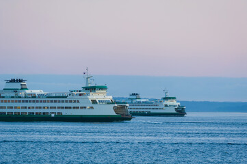 Ferry Boats Cross Paths On the Way to Seattle and Bainbridge Island, Washington. Commuters and visitors ride the super ferry on its hourly run across Elliott Bay to the Kitsap Peninsula.