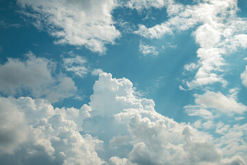 Naklejka na ściany i meble Beautiful cumulus clouds in the blue sky. natural background