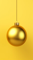 A sparkling golden Christmas ornament hanging from a string