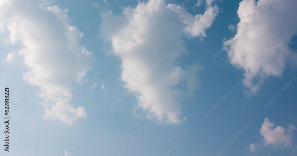 Wall mural cloud blue sky background time lapse beautiful white clouds approach the point of view backed by a v