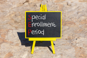 SEP symbol. Concept words SEP Special enrollment period on beautiful black chalk blackboard. Beautiful stone beach background. Medical and SEP Special enrollment period concept. Copy space.
