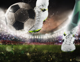 Football scene with close up of a soccer shoe hitting the ball with power