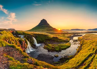 Foto op Plexiglas Kirkjufell Sunrise over volcanic Kirkjufell mountain with waterfall flowing in summer at Iceland