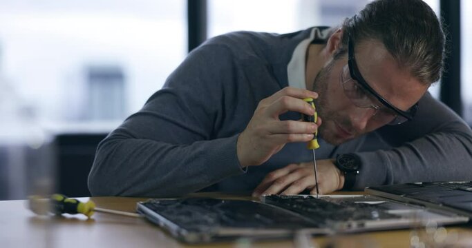 Hardware, maintenance and laptop with man in office for technician, programming and engineer. Developer, tools and electrician with male employee for technology, circuit board and electrical repair