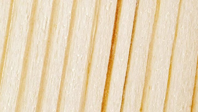 Wooden surface, structure, processed, with horizontal parallel stripes, rotating, turning, close-up macro, top view
