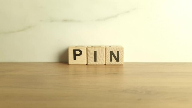 PIN abbreviation from wooden blocks. Personal Identification Number acronym. Technology and security concept