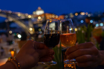 romantic toast with port wine in Porto Portugal in the evening in a restaurant