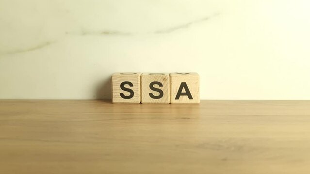 SSA abbreviation from wooden blocks. Social Security Administration acronym