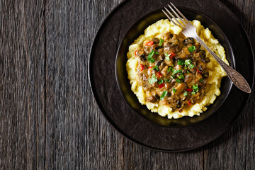 potato mash topped with mushroom gravy in bowl