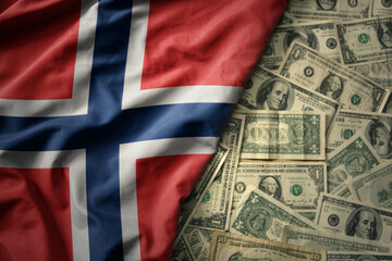 colorful waving national flag of norway on a american dollar money background. finance concept