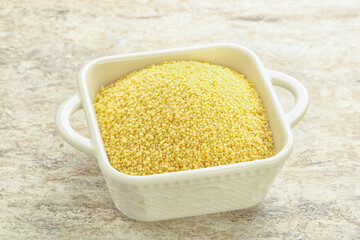 Raw couscous in the bowl
